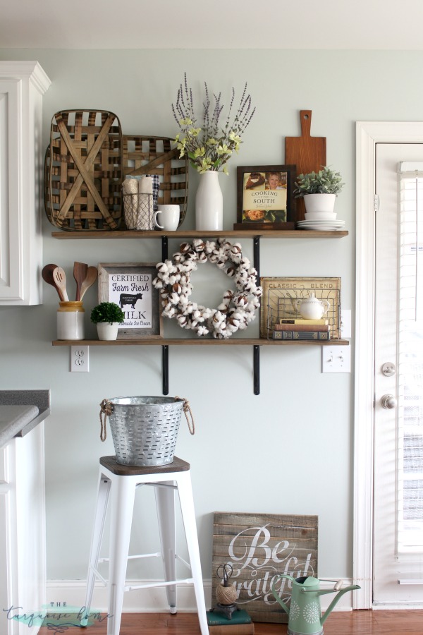 Decorating shelves in a farmhouse kitchen