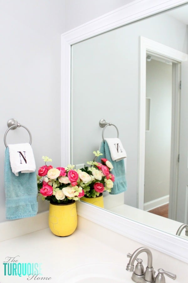 This simple DIY is easy and cheap! LOVE the custom look! | How to Frame a Builder-Grade Mirror | TheTurquoiseHome.com