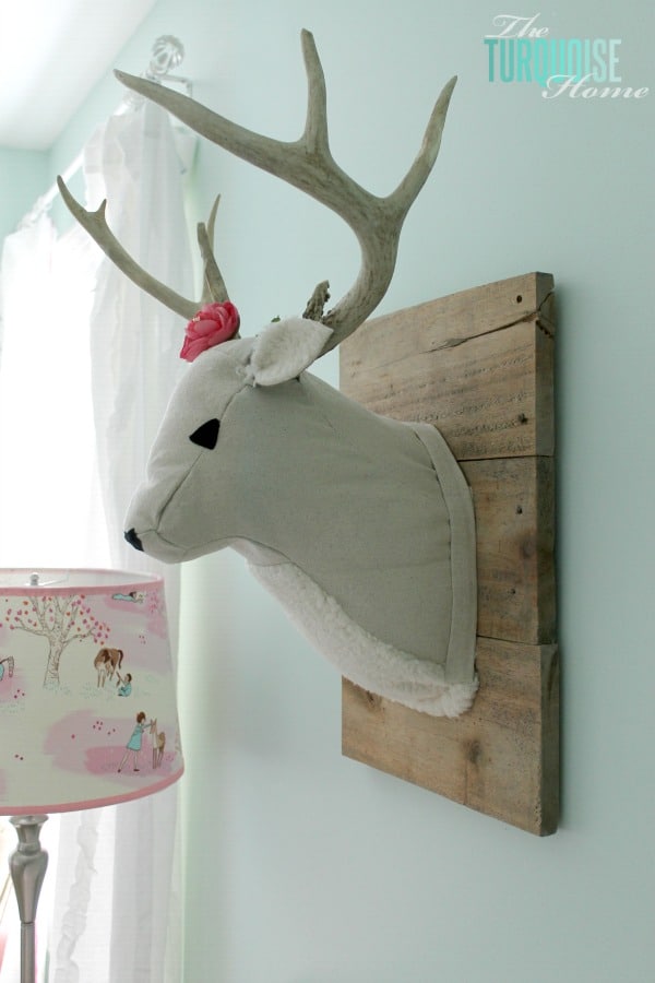 All of the pretty pink and turquoise touches with a woodland theme make a sweet retreat for any little girl. | Baby Girl's Woodland Nursery | All the details at TheTurquoiseHome.com