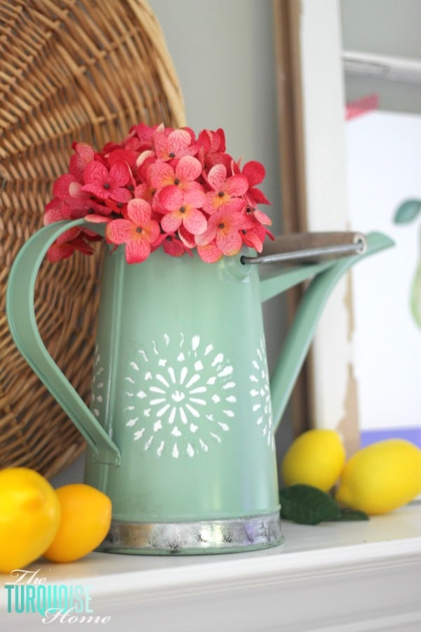 I love these fresh pops of colors and citrus inspiration on this fun summer mantel! A Garden and Lemonade Stand Summer Mantel. Get all the juicy details at TheTurquoiseHome.com