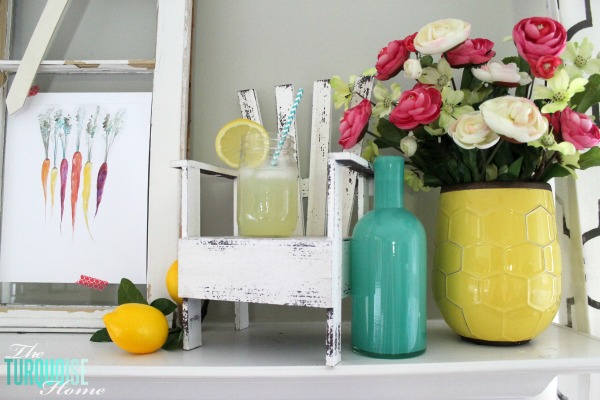 I love these fresh pops of colors and citrus inspiration on this fun summer mantel! A Garden and Lemonade Stand Summer Mantel. Get all the juicy details at TheTurquoiseHome.com