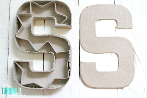 Cut the top off of a simple paper mache initial from Hobby Lobby and fill it with moss and flowers for a sweet addition to a baby girl's nursery. | DIY Flower and Moss Initial Art via TheTurquoiseHome.com