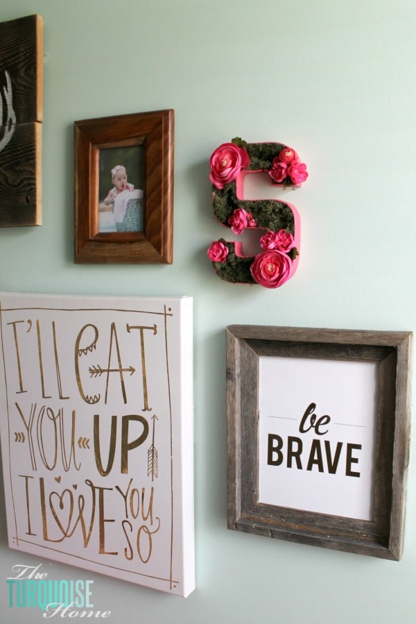 Such a sweet, girly gallery wall in a woodland nursery. All of the details at TheTurquoiseHome.com 