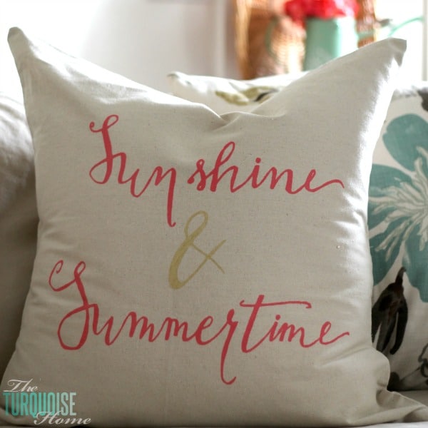 Sunshine and Summertime! It's a pretty, DIY stenciled drop-cloth pillow tutorial at TheTurquoiseHome.com. I love the pretty pink and gold pops of color and the fun hand-lettered stencil!