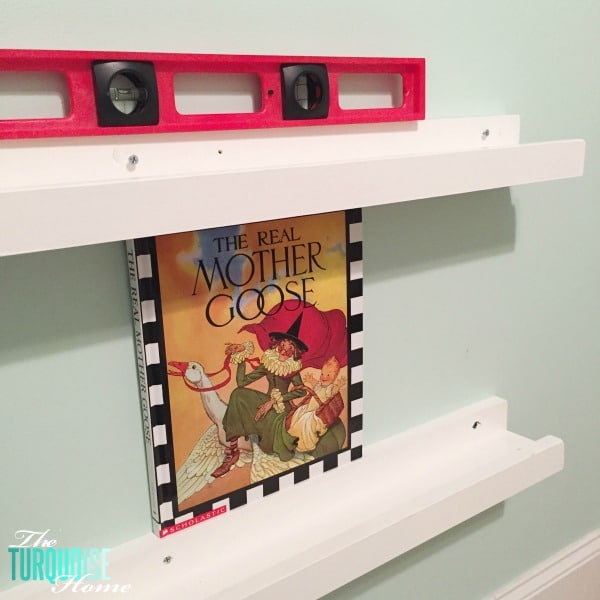 These simple DIY $10 ledges are easy to make; I love the price; and they make such a huge impact. Perfect for storing books on an empty wall in a kids room or play room. | Tutorial via TheTurquoiseHome.com