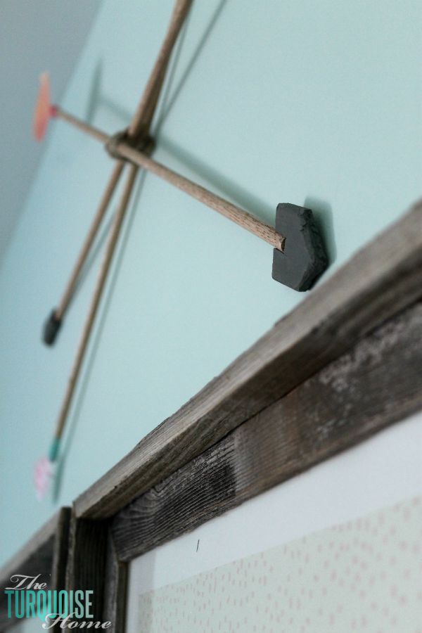 These DIY decorative arrows are so inexpensive and cute! The perfect finishing touch to a girl's woodland nursery. | Details at TheTurquoiseHome.com