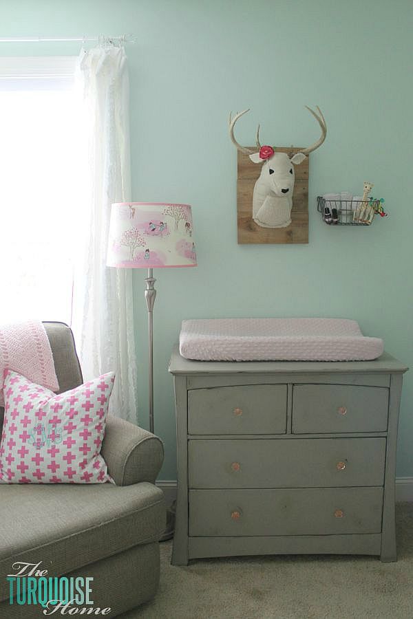 All of the pretty pink and turquoise touches with a woodland theme make a sweet retreat for any little girl. | Baby Girl's Woodland Nursery | All the details at TheTurquoiseHome.com