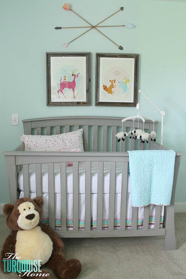 All of the pretty pink and turquoise touches with a woodland theme make a sweet retreat for any little girl. | Baby Girl's Woodland Nursery | All the details at TheTurquoiseHome.com 