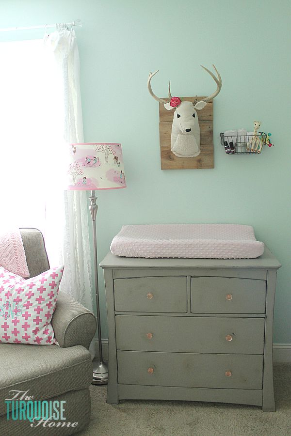 All of the pretty pink and turquoise touches with a woodland theme make a sweet retreat for any little girl. | Baby Girl's Woodland Nursery | All the details at TheTurquoiseHome.com