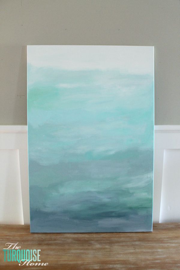 Gorgeous blue waters have the makings of an expensive abstract art piece, but it's not! It's a quick DIY project with just paint and a canvas! Less then $22 for custom, gorgeous art in your home. | Tutorial at TheTurquoiseHome.com