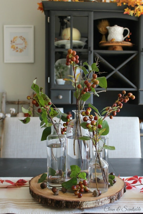 Decorating with Faux Stems on a wooden board on the table.