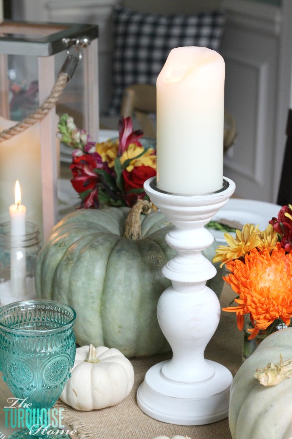 Gorgeous! This pretty, colorful fall or Thanksgiving tablescape is just beautiful with pops of turquoise, orange and red! And those beautiful goblets are my fave!