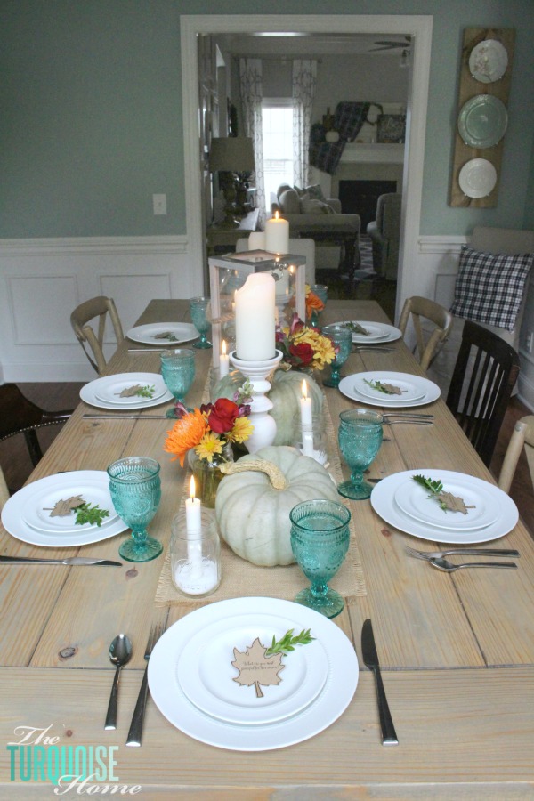 Gorgeous! This pretty, colorful fall or Thanksgiving tablescape is just beautiful with pops of turquoise, orange and red! And those beautiful goblets are my fave!