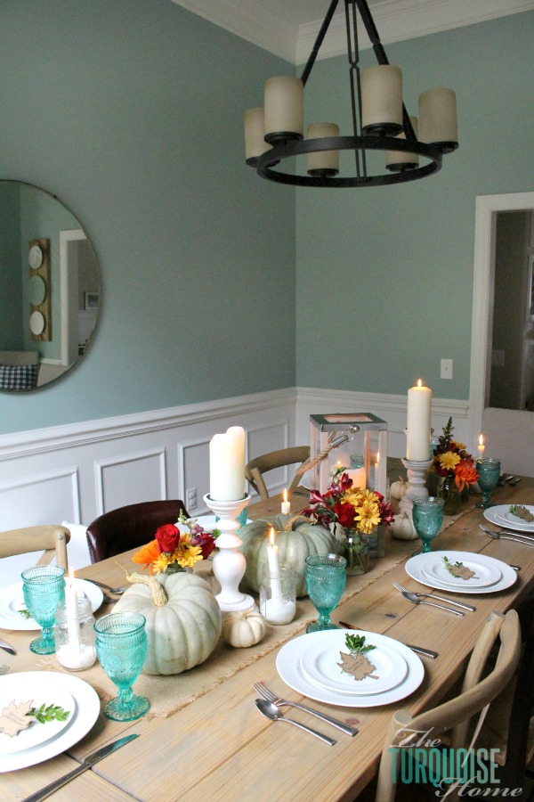 Gorgeous! This pretty, colorful fall or Thanksgiving tablescape is just beautiful with pops of turquoise, orange and red! And those beautiful goblets are my fave!