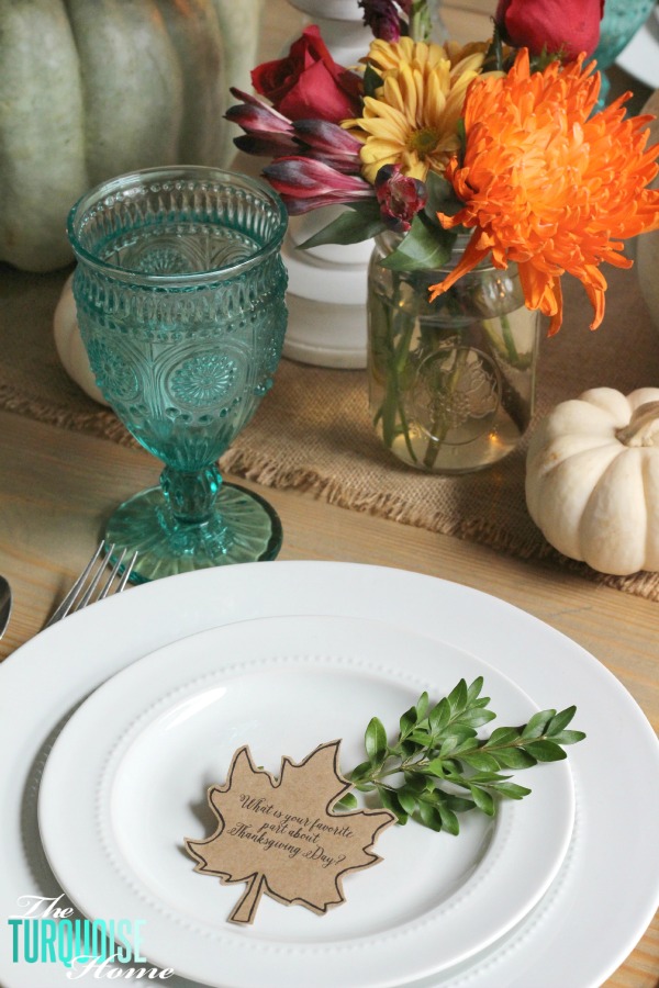 Gorgeous! This pretty, colorful fall or Thanksgiving tablescape is just beautiful with pops of turquoise, orange and red! And those beautiful goblets are my fave!