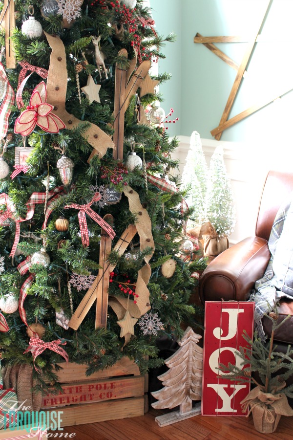 A decorated country plaid and burlap holiday tree
