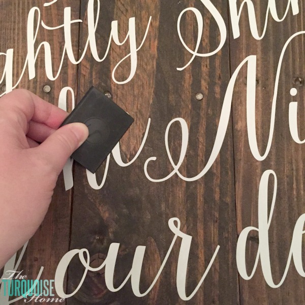 Personalize your Christmas decor with a DIY lettered pallet sign! Full tutorial at TheTurquoiseHome.com