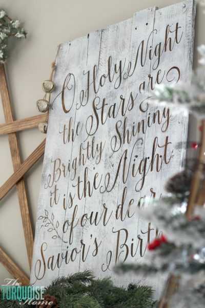 Personalize your Christmas decor with a DIY lettered pallet sign! Full tutorial at TheTurquoiseHome.com