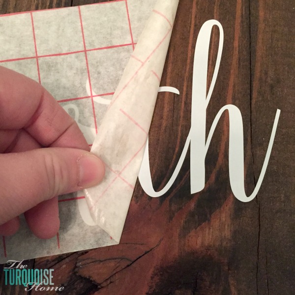 Personalize your Christmas decor with a DIY lettered pallet sign! Full tutorial at TheTurquoiseHome.com