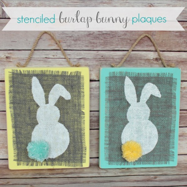 Stenciled Burlap Bunny Plaques on a wooden wall.