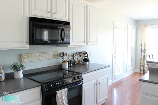 Love this light and airy farmhouse look!! Kitchen painted in Sea Salt (Sherwin Williams). | All the details at TheTurquoiseHome.com