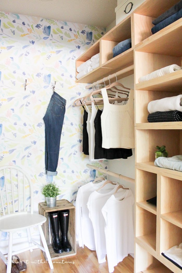 DIY Master Bedroom Closet with wooden shelves.