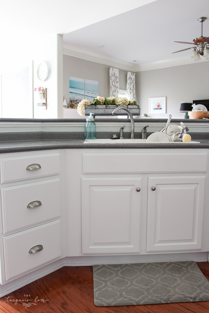 Installing cabinet hardware can be intimidating! This simple trick makes installing new cabinets pulls so easy!