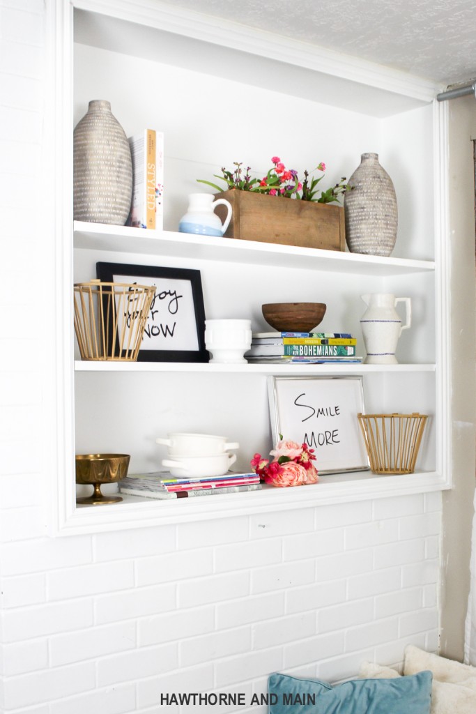 A white built in bookcase shelf.