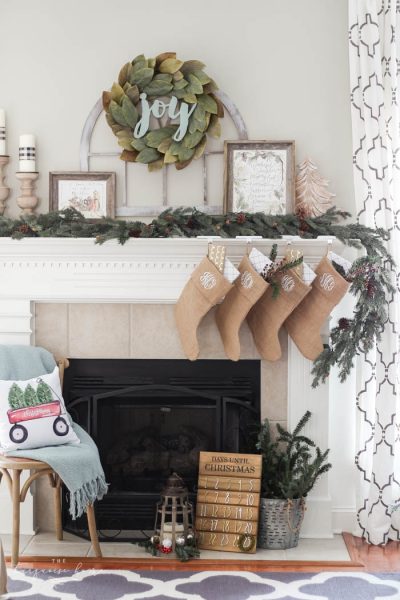 Pretty magnolia wreath and cathedral window are gorgeous for Christmas and can be kept up all winter long! How to Use Winter Decorations for Christmas