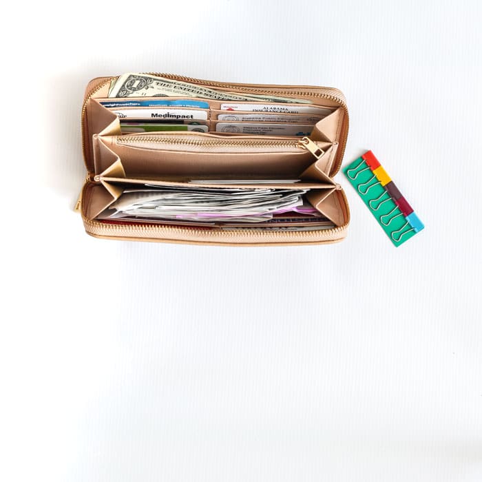 An organized wallet is the best! I use Rachel Cruze's tan wallet for optimal purse organization! | 30 Days to Less of a Hot Mess Challenge