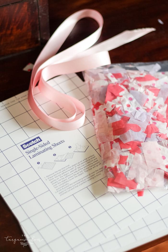 We used this in my daughter's Kindergarten class party! The kids LOVED it! | DIY Tissue Paper Sun Catcher Valentine's Kid Craft