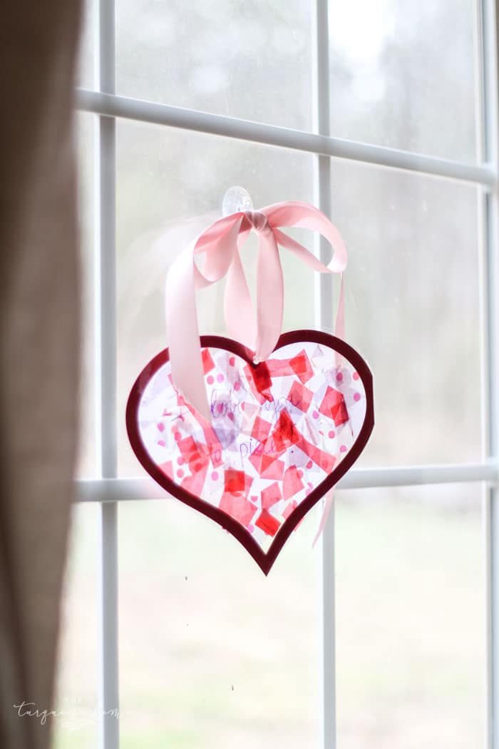 We used this in my daughter's Kindergarten class party! The kids LOVED it! | DIY Tissue Paper Sun Catcher Valentine's Kid Craft