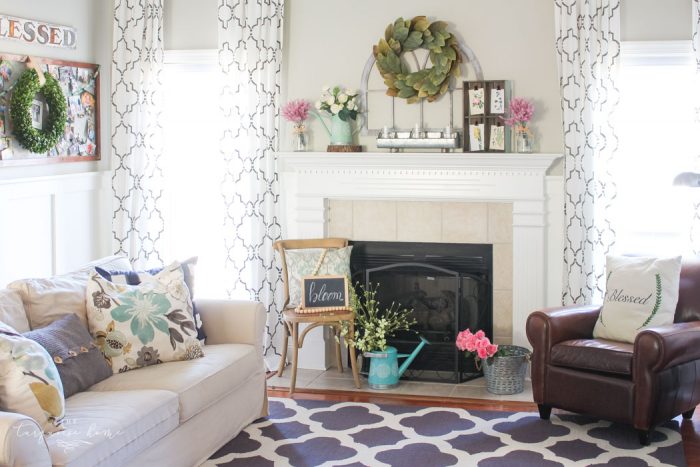 Isn't this just the prettiest pink and turquoise mantel?! Simple Floral Spring Mantel