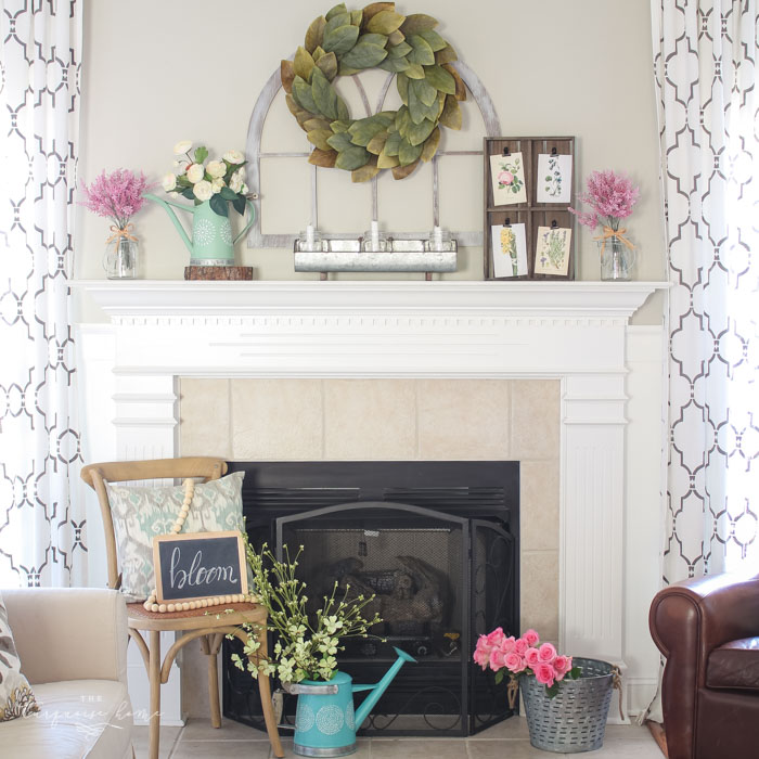 Isn't this just the prettiest pink and turquoise mantel?! Simple Floral Spring Mantel