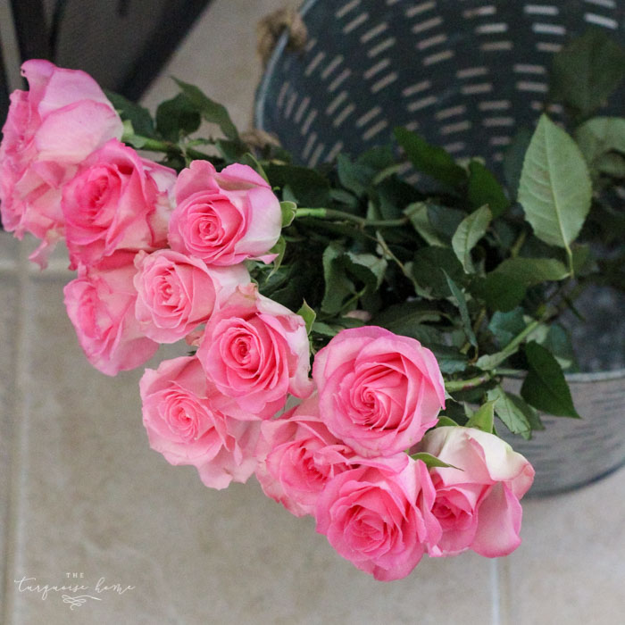 Isn't this just the prettiest pink and turquoise mantel?! Simple Floral Spring Mantel