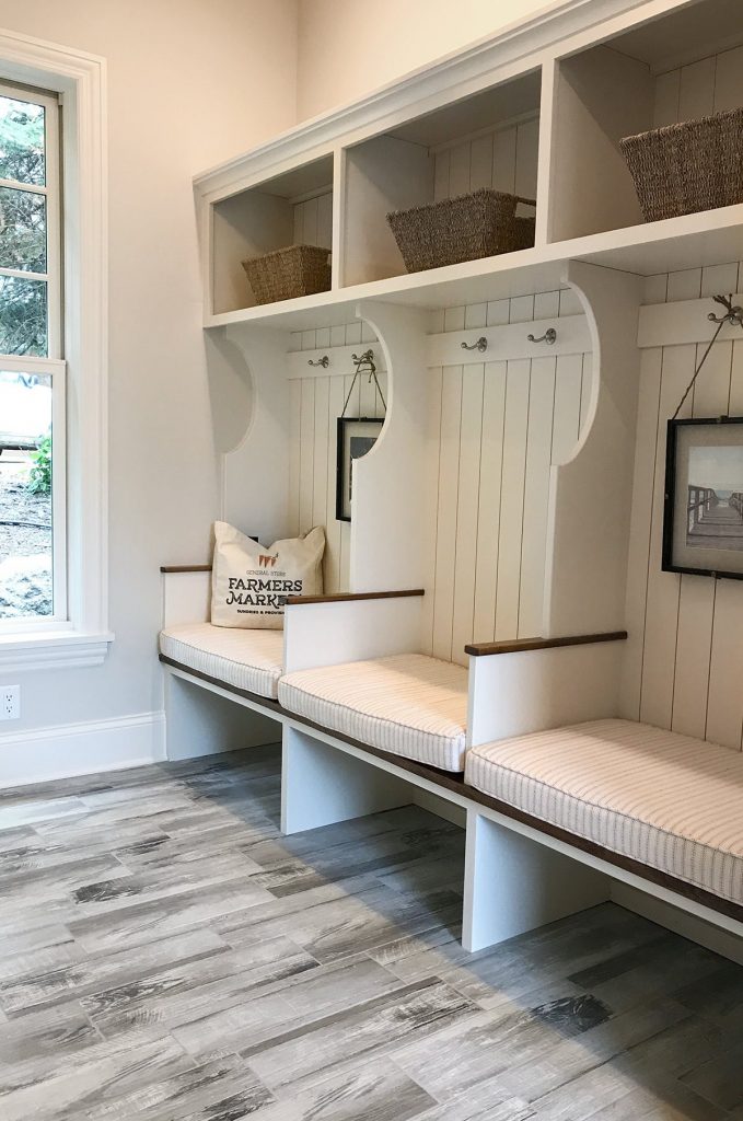 artisan home tour shiplap mudroom with cubbies and hooks gray wood floor 679x1024