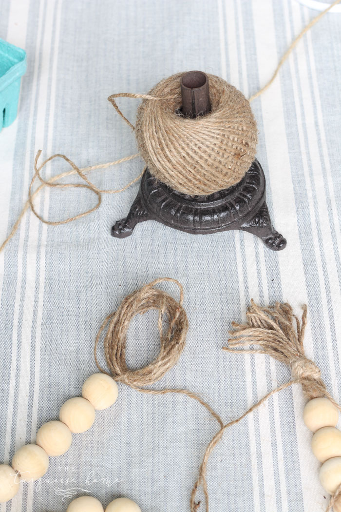 Super cute DIY Wood Bead Garland with Tassels is so easy and fun to make! Cheap, too!!