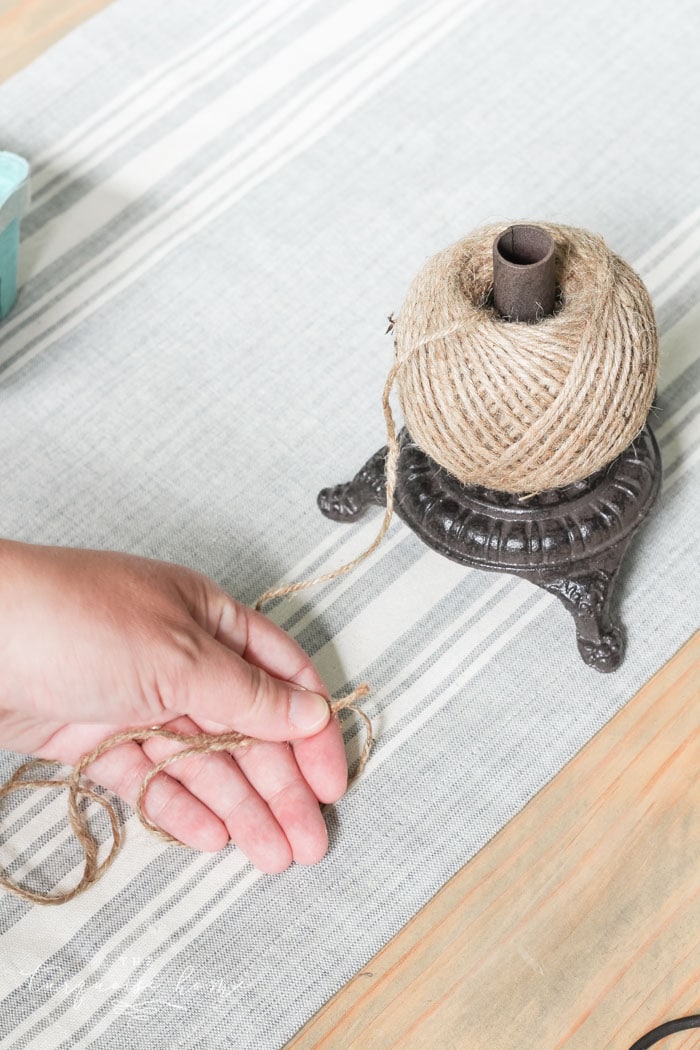 $5 DIY: How to Make a Wood Bead Garland with Tassels  Little House of Four  - Creating a beautiful home, one thrifty project at a time.