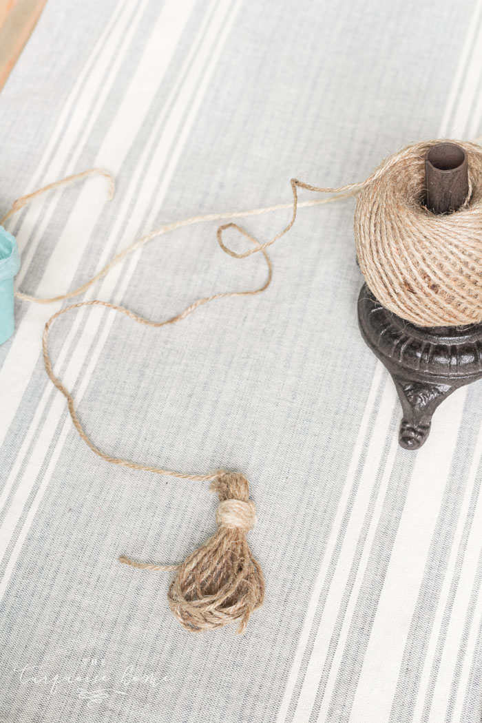 Super cute DIY Wood Bead Garland with Tassels is so easy and fun to make! Cheap, too!!