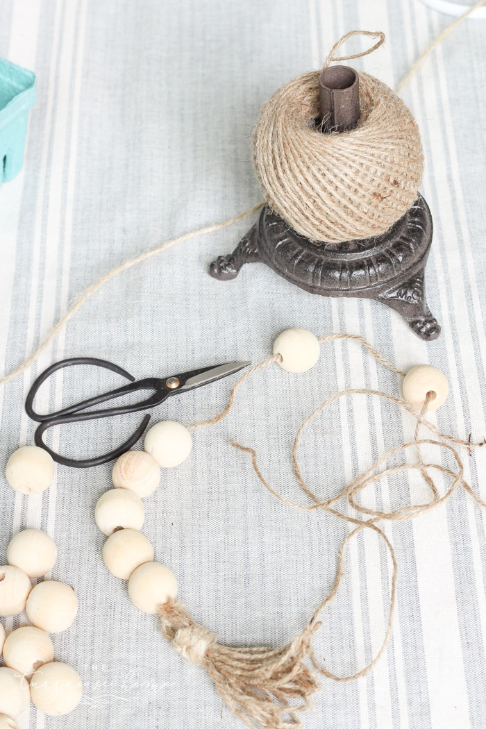 Super cute DIY Wood Bead Garland with Tassels is so easy and fun to make! Cheap, too!!