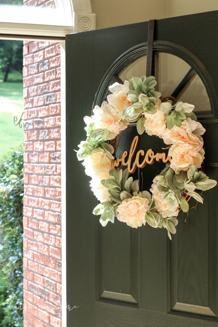 A lamb's ear wreath is the perfect addition to my front door. LOVE the "welcome" cut out sign in the middle!