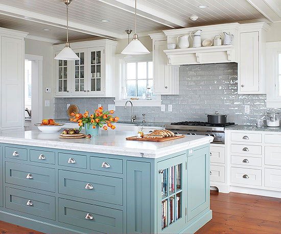 A Cornflower Blue kitchen Island with white outer cabinets.