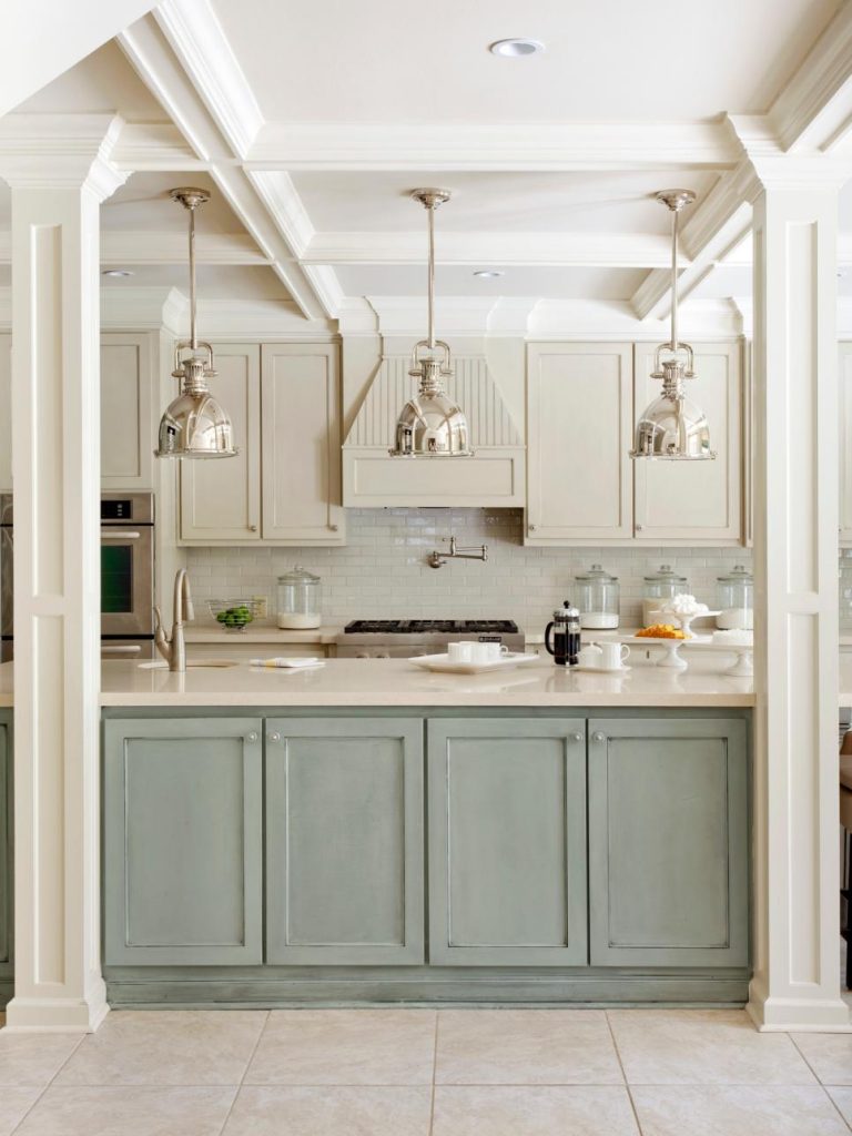 A Distressed Duck Egg Blue kitchen Island with shiny stainless steel pendant lights.