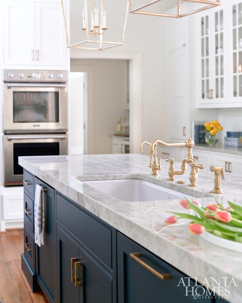 Navy Kitchen Island with brass sink faucet hardware.