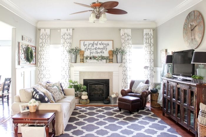 Simple farmhouse fall mantel with a DIY wooden sign