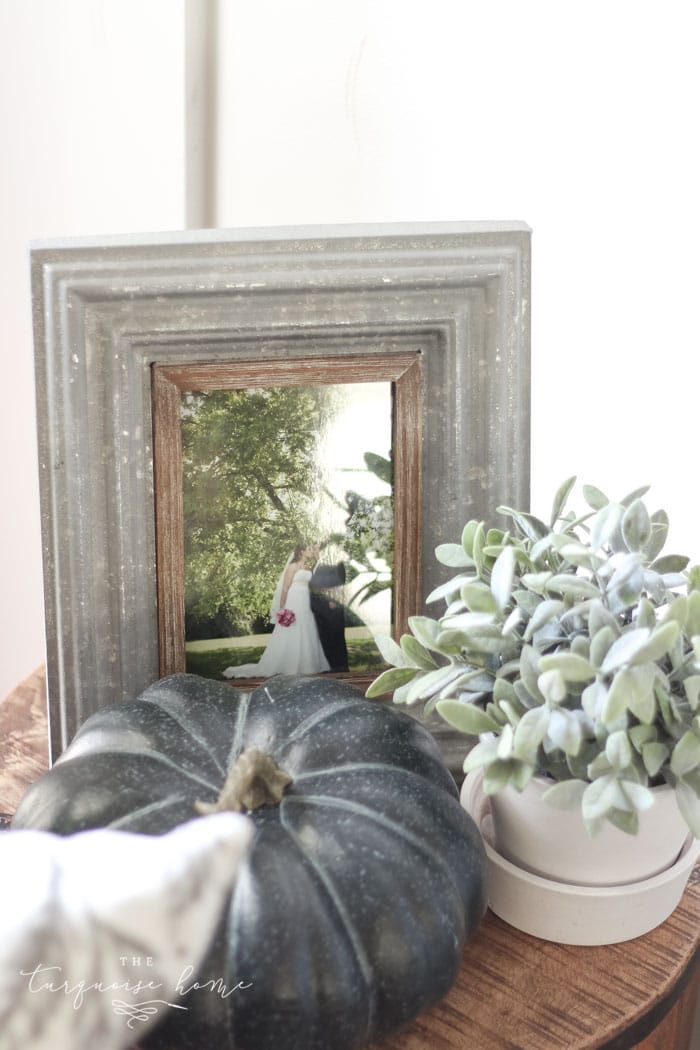 Simple farmhouse fall mantel with a DIY wooden sign 