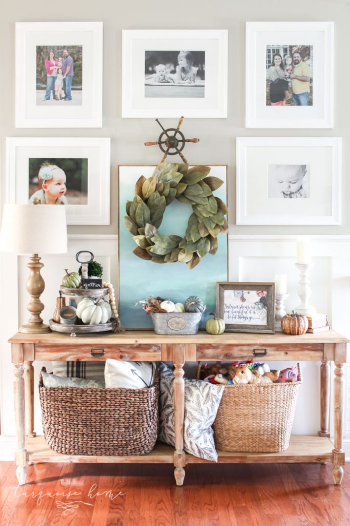gallery wall with tiered farmhouse stand and magnolia wreath