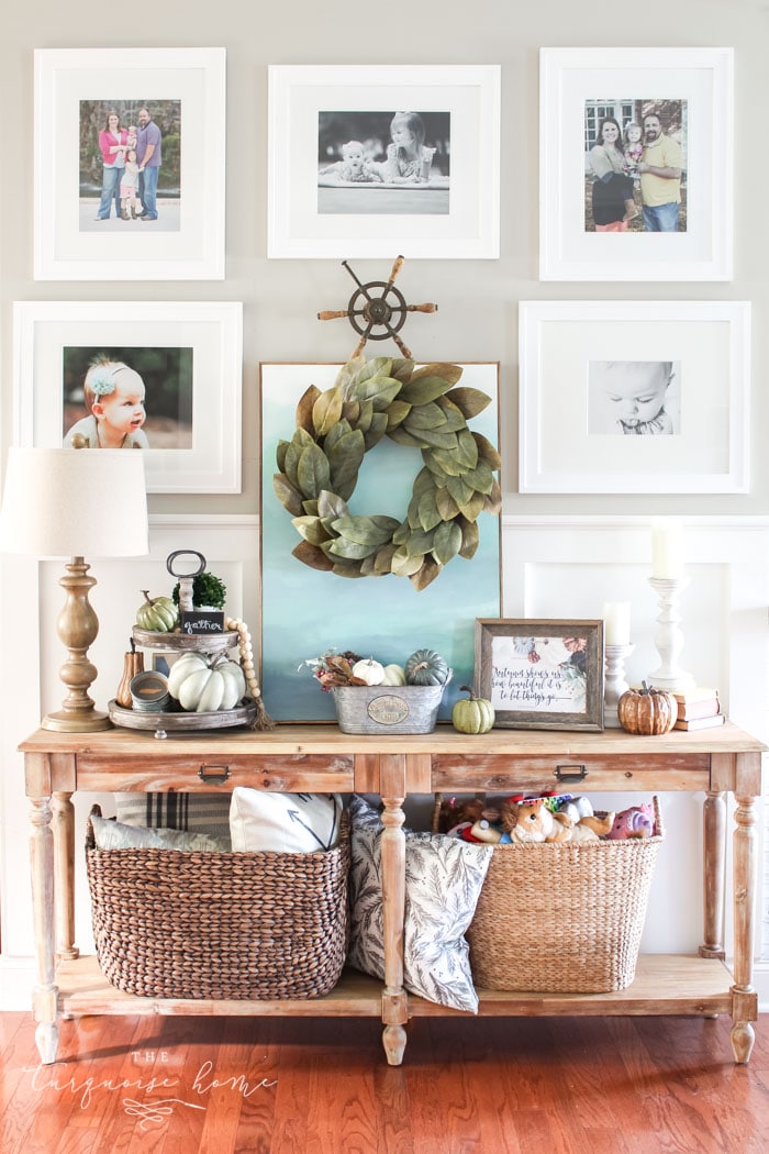 Love this #fixerupper style! Fall console table and gallery wall with tiered farmhouse stand and magnolia wreath
