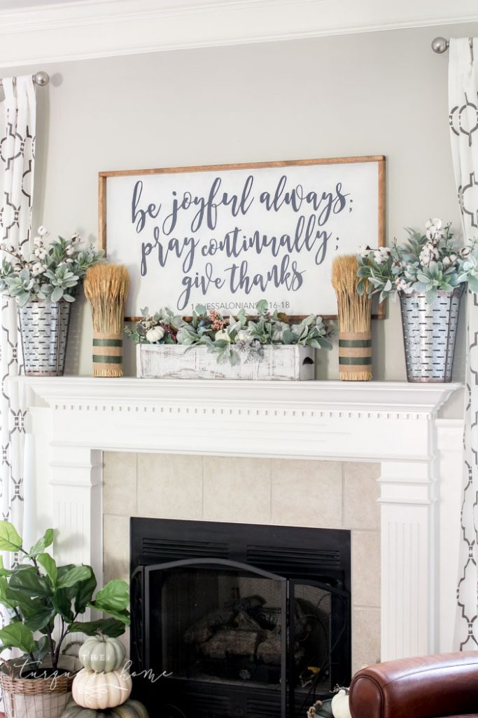 Beautiful Fall Mantel with a homemade large wooden sign and bundles of wheat!