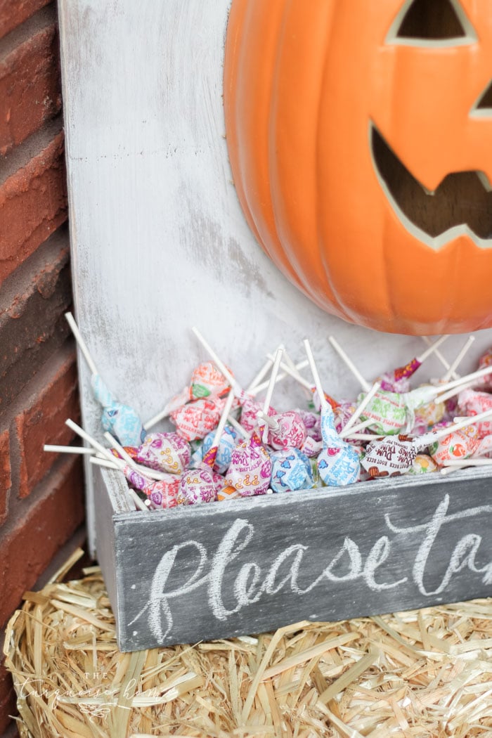 Adorable DIY lighted pumpkin candy holder - perfect for Halloween night!